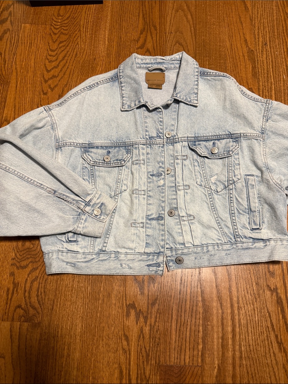 American Eagle distressed light wash crop jean jacket - size M